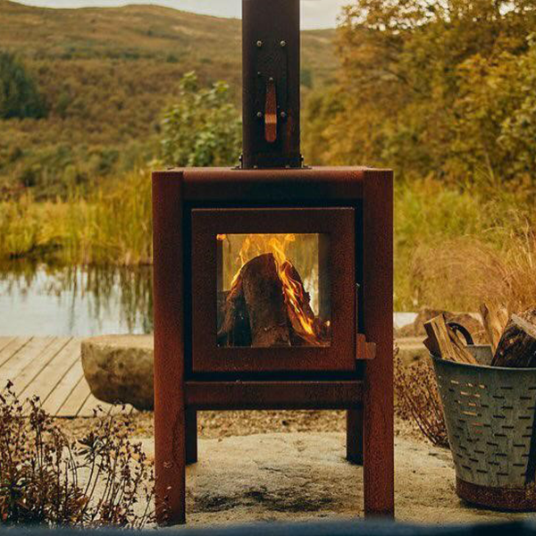 A fire burning in a brown outdoor fireplace
