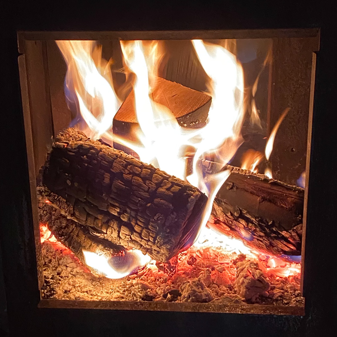Logs burning inside a log burner