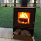 A fire burning in the L'Bode Urban Corten Edition Wood Burner