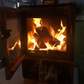 A fire burning in the L'Bode Urban Corten Edition Wood Burner