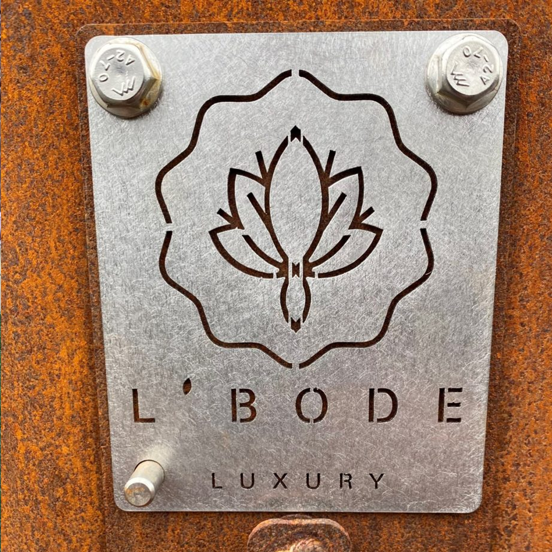 L'Bode Luxury Brand Decal on side of a fireplace